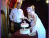 Wedding bouquet and garter. Wedding cake.